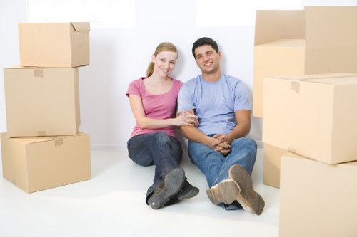 Professional movers loading furniture on a residential street