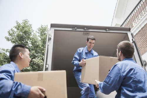 Professional moving team handling boxes in Strawberry Hill